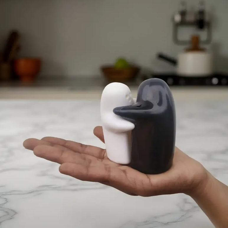 Spooki: Ceramic Salt & Pepper Shaker Set with Cute Hug Design, Easy Refill & Dispense, Black & White Couple Seasoning Jars for Dining, Kitchen & Gift Décor